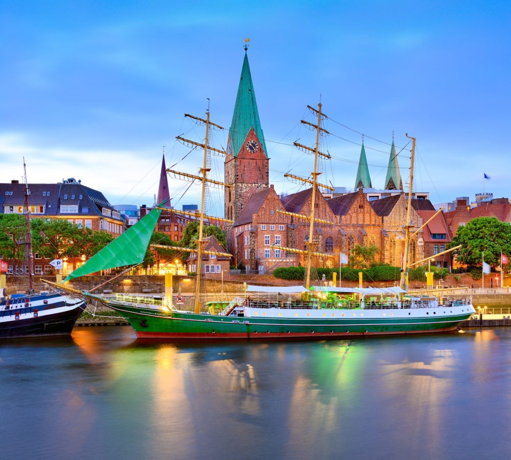 Bremen, Germany - View of Bremen riverside with Alexander Von Humboldt on Weser and Unser Lieben Frauen Kirchhof (Church of Our Lady).